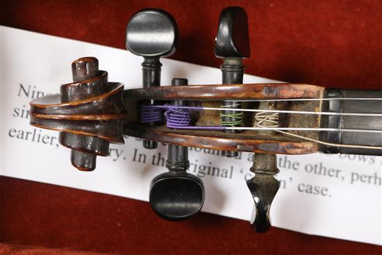 A silver mounted violin bow, an ivory mounted violin bow and a late 19th century German violin, cased